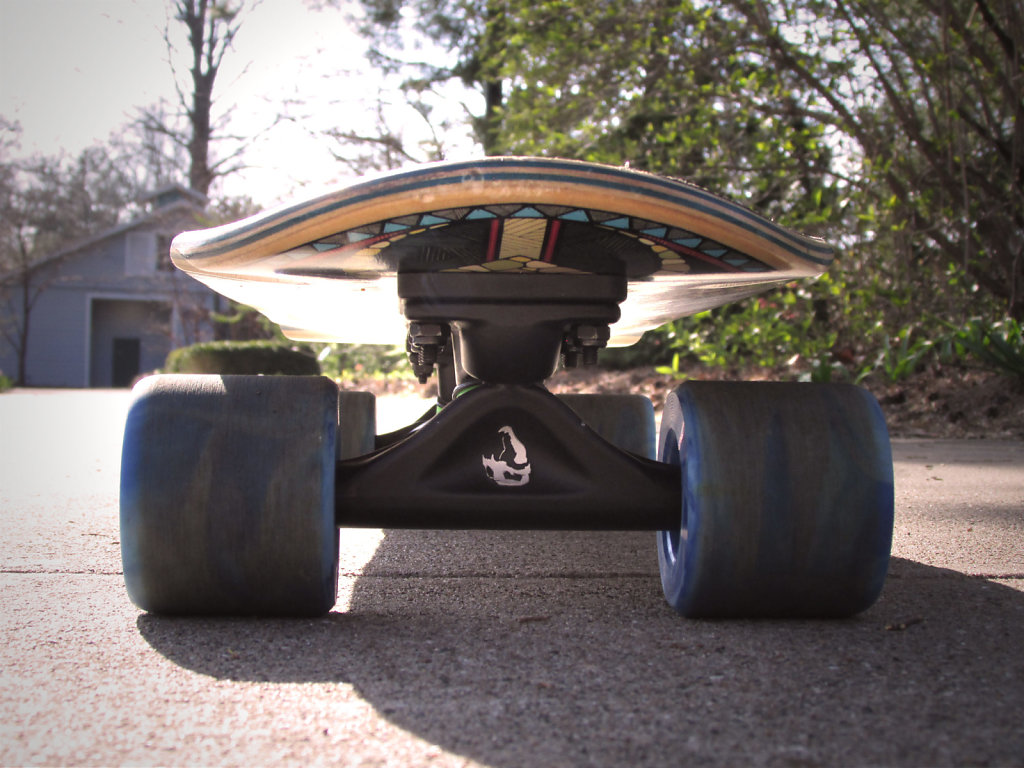 Skateboard facing forward on sidewalk