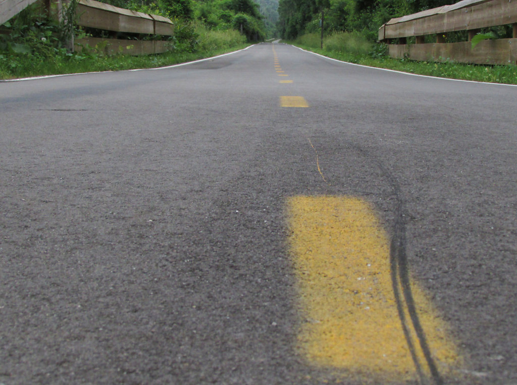 asphalt with center yellow stripes